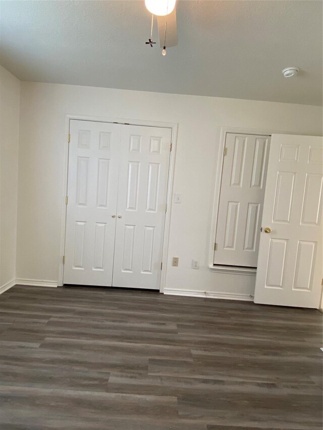 4406 Bobbie Ann Dr, Granbury, TX 76049 - unfurnished bedroom with baseboards, ceiling fan, dark wood finished floors, and a closet