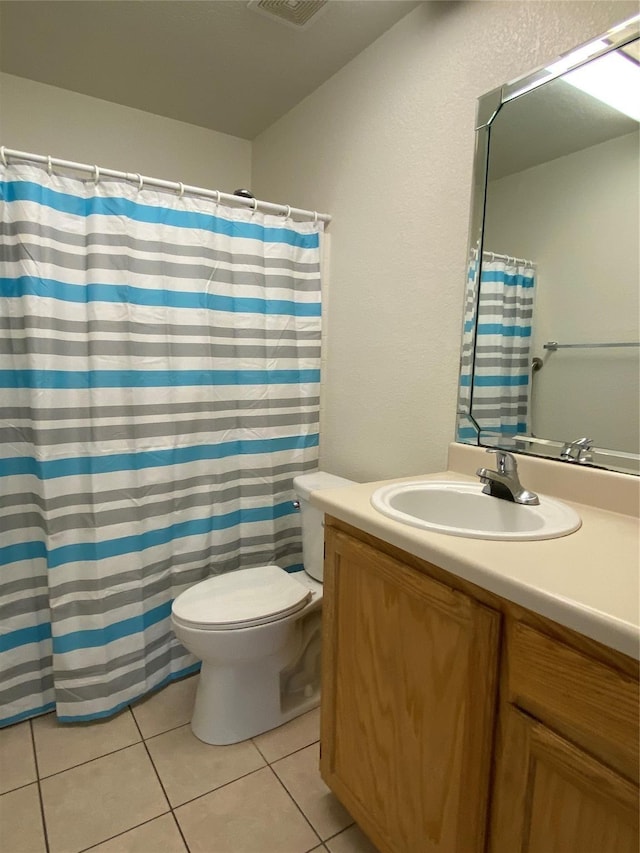 4406 Bobbie Ann Dr, Granbury, TX 76049 - bathroom with toilet, vanity, visible vents, tile patterned floors, and a shower with shower curtain
