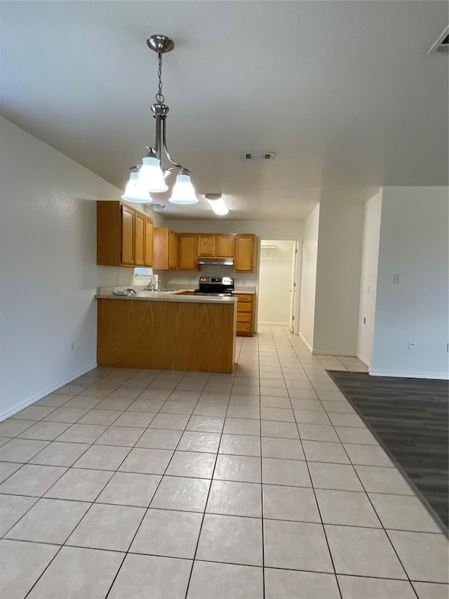 4406 Bobbie Ann Dr, Granbury, TX 76049 - kitchen featuring open floor plan, a peninsula, light tile patterned flooring, and stainless steel electric stove