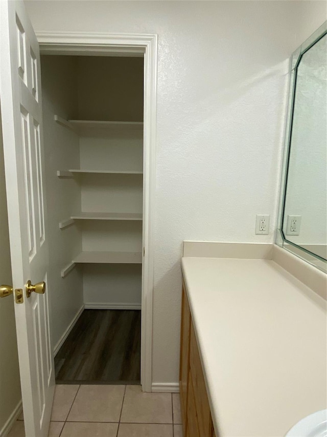 4406 Bobbie Ann Dr, Granbury, TX 76049 - bathroom with tile patterned flooring, baseboards, and vanity