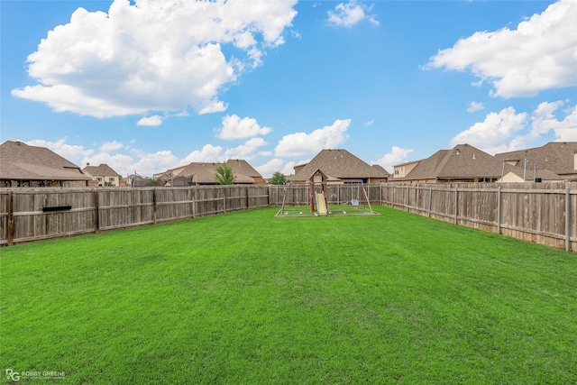 view of yard with a residential view and a fenced backyard
