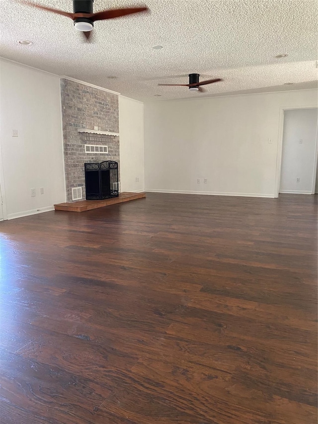 unfurnished living room with ceiling fan, visible vents, a textured ceiling, and dark wood-type flooring