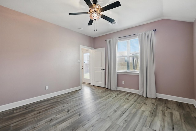 7616 Duck Bay Rd, Fort Worth, TX 76120 - spare room with wood finished floors, baseboards, ceiling fan, and vaulted ceiling