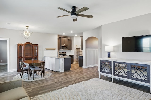 7616 Duck Bay Rd, Fort Worth, TX 76120 - living room featuring ceiling fan, baseboards, wood finished floors, recessed lighting, and arched walkways