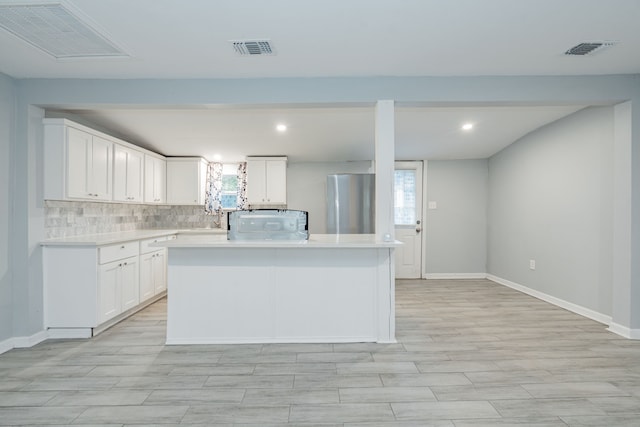 309 James St, Terrell, TX 75160 - kitchen with light countertops, tasteful backsplash, healthy amount of natural light, baseboards, and recessed lighting