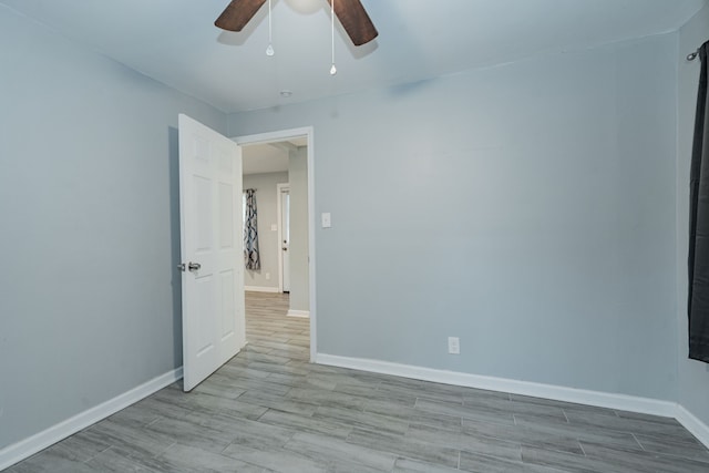 309 James St, Terrell, TX 75160 - spare room featuring ceiling fan, baseboards, and wood finished floors