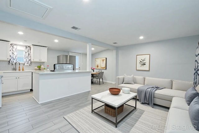 309 James St, Terrell, TX 75160 - living room featuring recessed lighting and light wood-style flooring