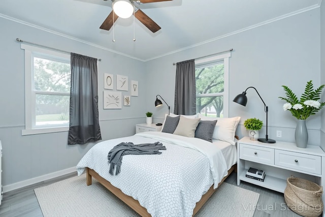 309 James St, Terrell, TX 75160 - bedroom with light wood-style floors, baseboards, crown molding, and a ceiling fan