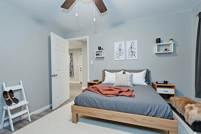 309 James St, Terrell, TX 75160 - bedroom featuring light wood finished floors, baseboards, and a ceiling fan