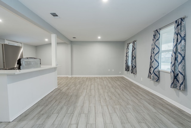 309 James St, Terrell, TX 75160 - bar featuring light wood-type flooring, fridge, recessed lighting, and baseboards