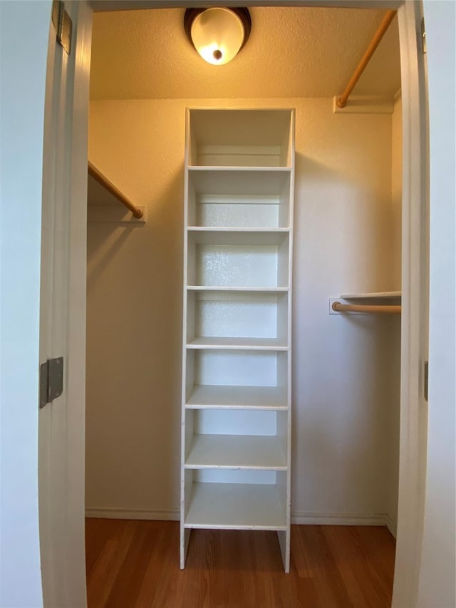 615 Parker Ln, Granbury, TX 76048 - spacious closet with wood finished floors