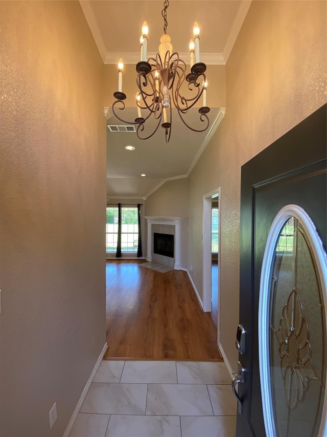 615 Parker Ln, Granbury, TX 76048 - entrance foyer featuring baseboards, a chandelier, and crown molding