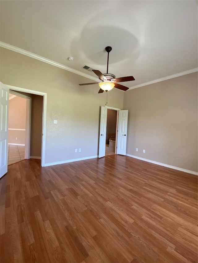 615 Parker Ln, Granbury, TX 76048 - unfurnished bedroom featuring wood finished floors, baseboards, and ornamental molding