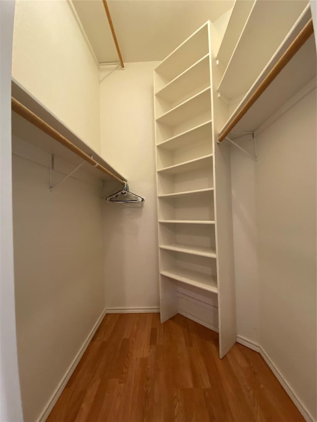 615 Parker Ln, Granbury, TX 76048 - spacious closet featuring wood finished floors