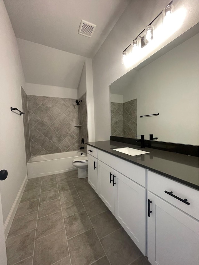 6141 Rodin Dr, Royse City, TX 75189 - bathroom featuring vanity, toilet, shower / bath combination, tile patterned floors, and vaulted ceiling