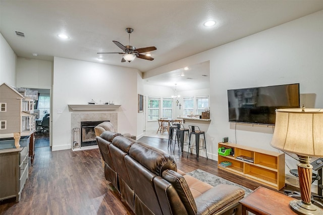 living area with a ceiling fan, dark wood-style flooring, a fireplace, and recessed lighting