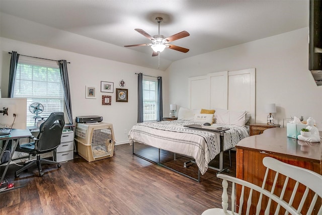 bedroom featuring vaulted ceiling, dark wood-style flooring, ceiling fan, and multiple windows