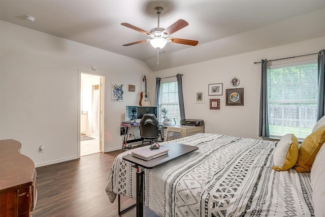 bedroom featuring baseboards, ensuite bathroom, a ceiling fan, and wood finished floors