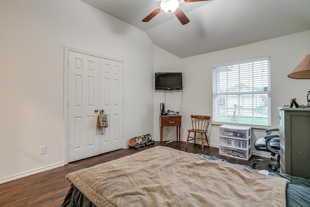 bedroom with baseboards, wood finished floors, a ceiling fan, and vaulted ceiling