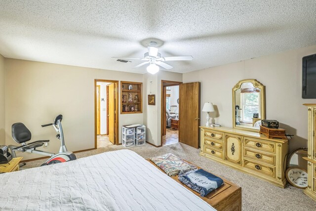 906 County Road 2770, Honey Grove, TX 75446 - bedroom featuring ceiling fan, light carpet, a textured ceiling, and visible vents