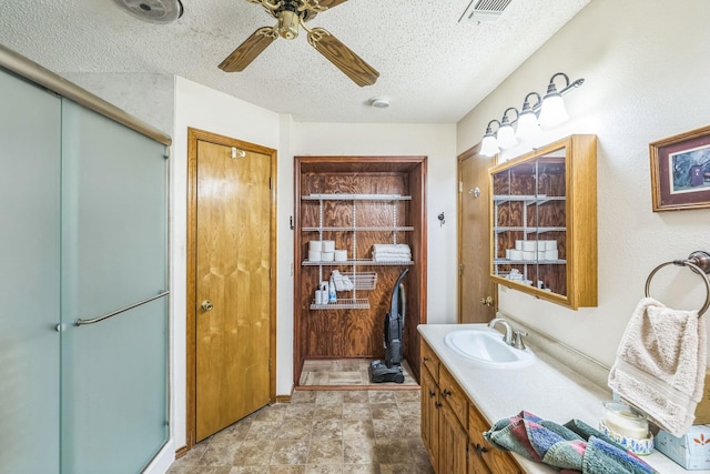 906 County Road 2770, Honey Grove, TX 75446 - bathroom with a shower with shower door, ceiling fan, vanity, and visible vents