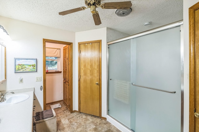 906 County Road 2770, Honey Grove, TX 75446 - full bathroom with a stall shower, vanity, a ceiling fan, and a textured ceiling