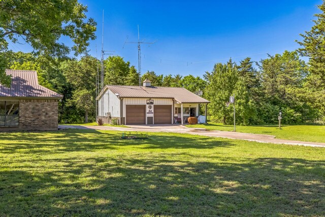 906 County Road 2770, Honey Grove, TX 75446 - exterior space with a yard, a garage, an outbuilding, and driveway