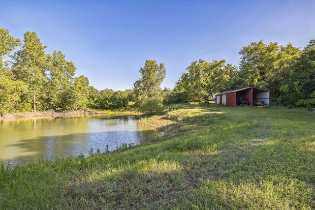 906 County Road 2770, Honey Grove, TX 75446 - property view of water with a pole building and a forest view