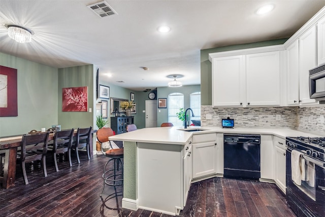 6844 Massa Ln, Frisco, TX 75034 - kitchen featuring a peninsula, a sink, dark wood-style floors, black appliances, and recessed lighting