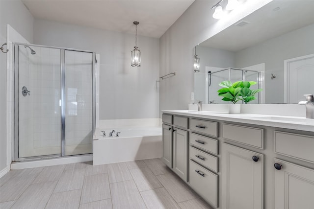6844 Massa Ln, Frisco, TX 75034 - full bathroom with a stall shower, double vanity, a sink, and a garden tub