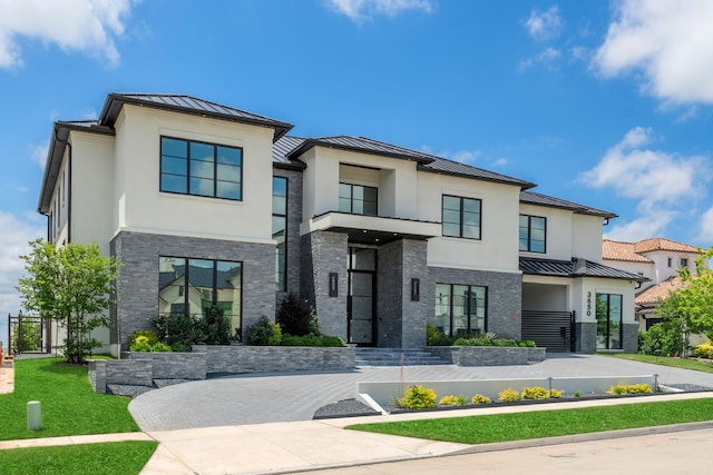 3650 Balfour Ct, Frisco, TX 75034 - contemporary house featuring a standing seam roof, metal roof, stone siding, and stucco siding