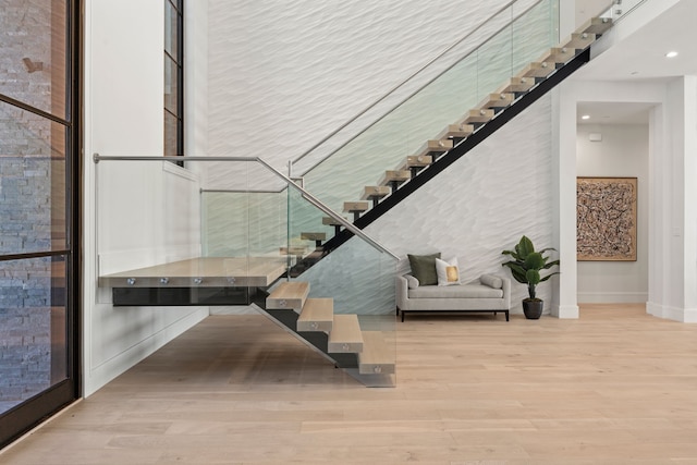 3650 Balfour Ct, Frisco, TX 75034 - stairs featuring wood finished floors, baseboards, and recessed lighting