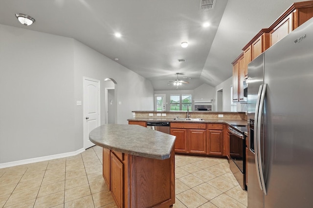 kitchen with ceiling fan, visible vents, a sink, arched walkways, and appliances with stainless steel finishes