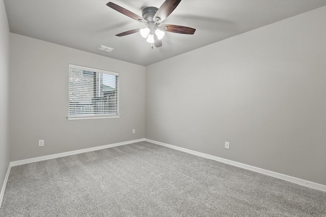unfurnished room featuring ceiling fan, carpet flooring, baseboards, and visible vents