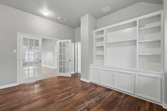 interior space featuring baseboards, dark wood finished floors, and french doors
