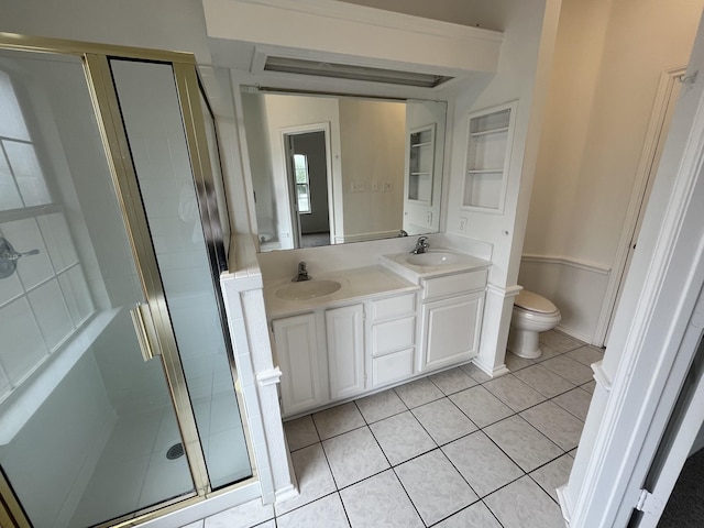 7636 Arbor Ridge Ct, Fort Worth, TX 76112 - bathroom featuring a sink, toilet, a stall shower, tile patterned flooring, and double vanity