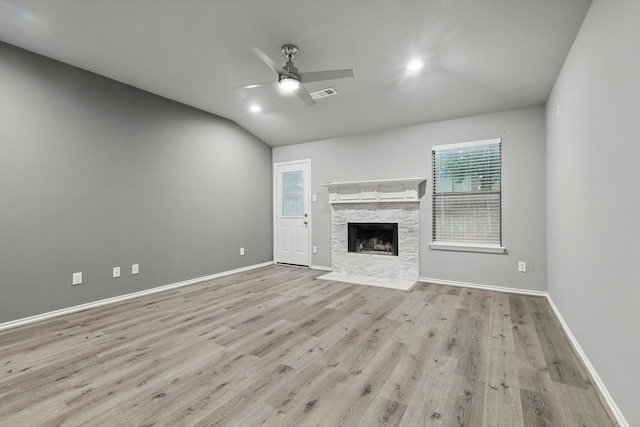 unfurnished living room featuring vaulted ceiling, visible vents, wood finished floors, and a healthy amount of sunlight