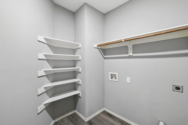 laundry room featuring baseboards, hookup for a washing machine, dark wood finished floors, laundry area, and electric dryer hookup