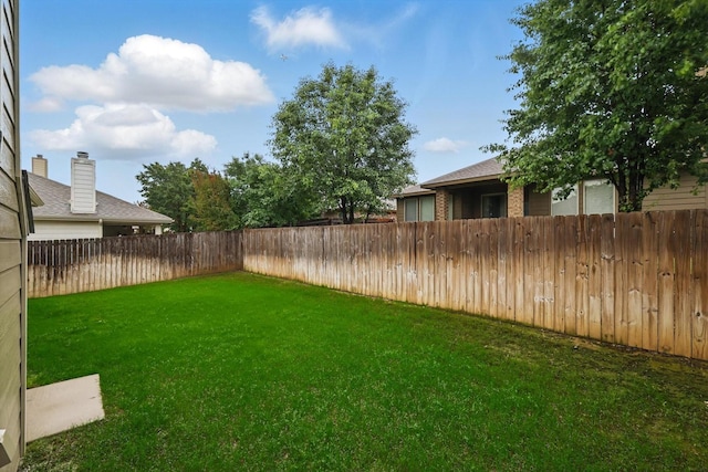 view of yard featuring a fenced backyard