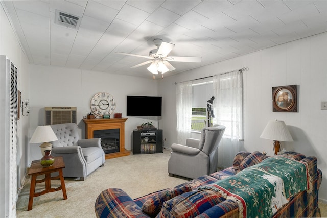 6111 County Road 2610, Bonham, TX 75418 - carpeted living area featuring a ceiling fan, a fireplace, a heating unit, and visible vents