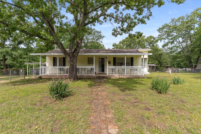 6111 County Road 2610, Bonham, TX 75418 - ranch-style home featuring a front lawn, covered porch, and fence
