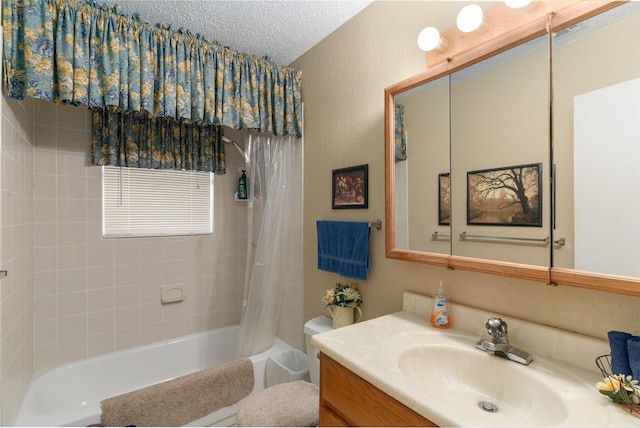 6111 County Road 2610, Bonham, TX 75418 - bathroom with a textured ceiling, shower / tub combo, and vanity