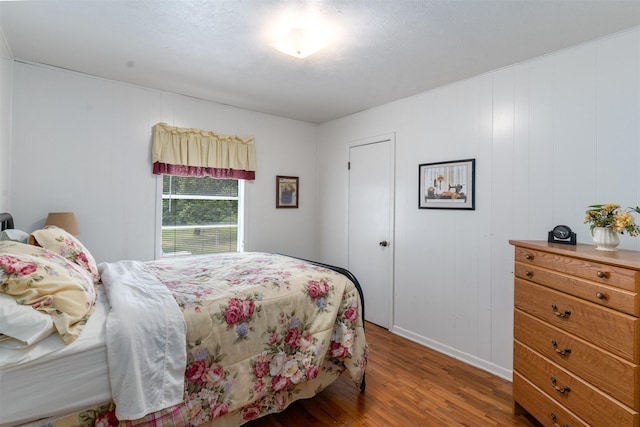 6111 County Road 2610, Bonham, TX 75418 - bedroom featuring baseboards and wood finished floors