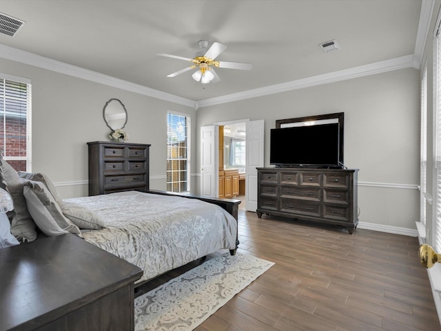 6330 Dublin Dr, Garland, TX 75044 - bedroom featuring baseboards, wood finished floors, ornamental molding, a ceiling fan, and connected bathroom