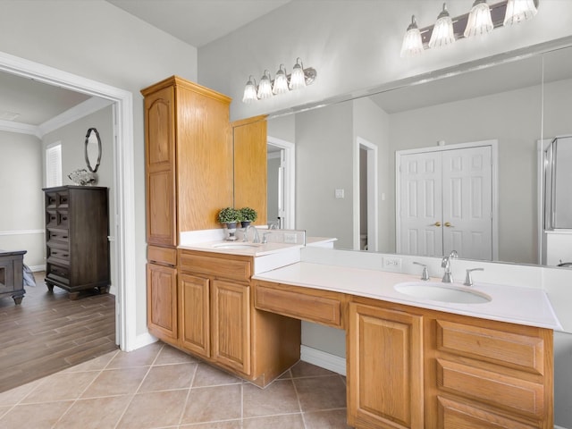 6330 Dublin Dr, Garland, TX 75044 - full bathroom featuring double vanity, crown molding, and baseboards