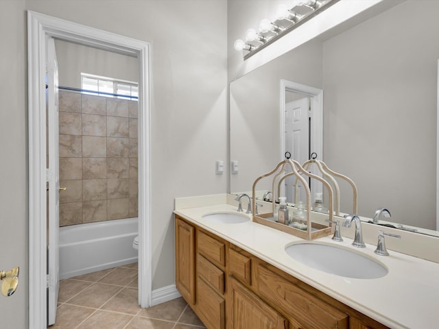 6330 Dublin Dr, Garland, TX 75044 - bathroom with tile patterned flooring, double vanity, toilet, and baseboards