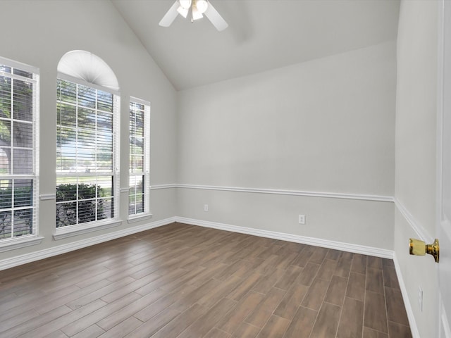 6330 Dublin Dr, Garland, TX 75044 - spare room with ceiling fan, dark wood-type flooring, baseboards, and high vaulted ceiling