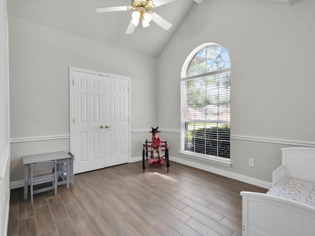 6330 Dublin Dr, Garland, TX 75044 - bedroom featuring wood finished floors, baseboards, a ceiling fan, high vaulted ceiling, and a closet