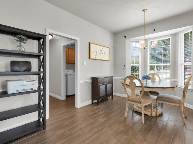 6330 Dublin Dr, Garland, TX 75044 - dining space featuring washer / dryer, dark wood-style flooring, baseboards, and a chandelier