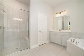 609 Alaina Dr, Desoto, TX 75115 - full bath with a stall shower, vanity, a bath, and tile patterned flooring